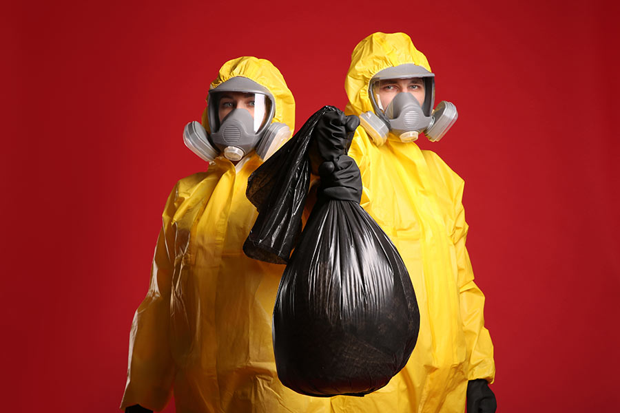 Biohazard cleanup team in yellow hazmat suits in McLean, VA